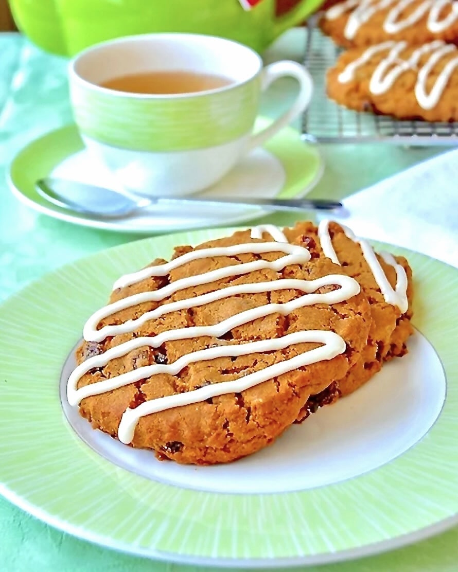 Molasses Raisin Biscuit Cookies with green tea service in background.