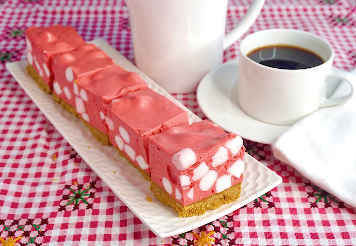Raspberry Marshmallow Chiffon Squares wide shot photo showing entire platter of cookies.