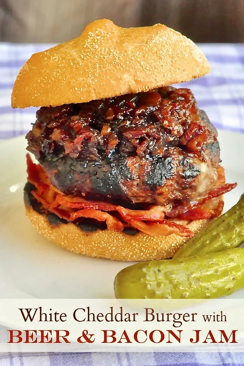 White Cheddar Burgers with Beer Bacon Jam photo if one burger with title text added for social Pinterest.