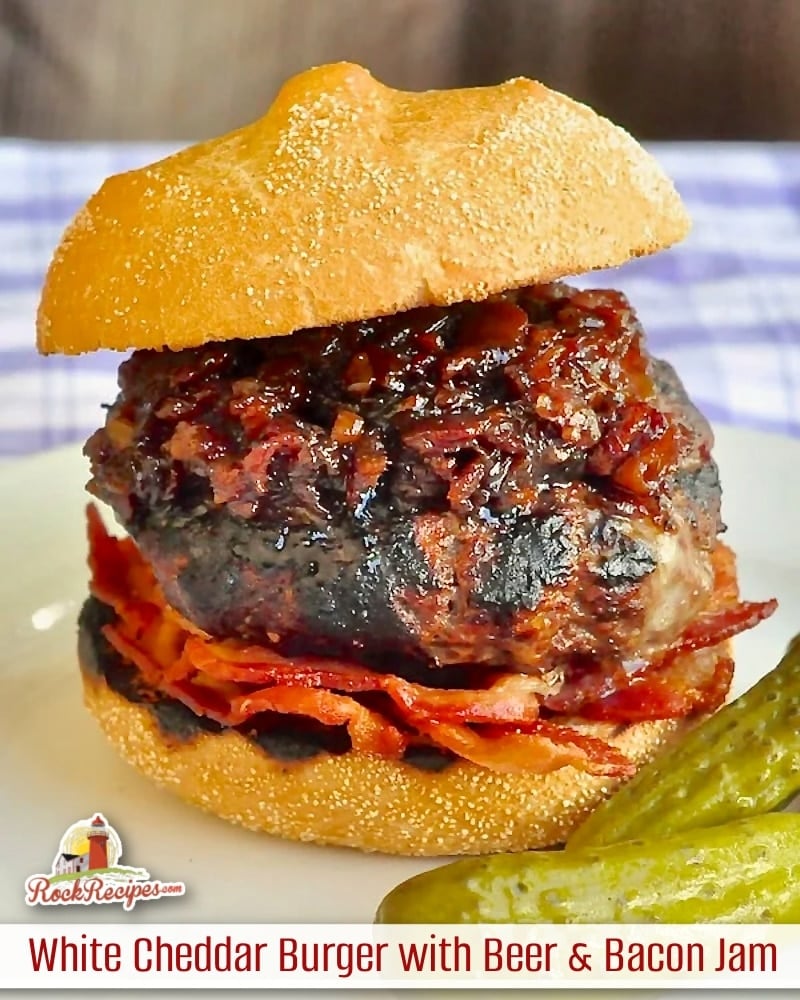 White Cheddar Burgers with Beer Bacon Jam photo if one burger with title text and logo added for social media posts