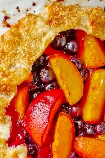 Blueberry Peach Summer Fruit Galette close up photo of filling and pastry for Google featured image.