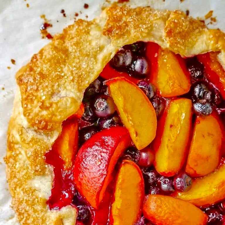 Blueberry Peach Summer Fruit Galette close up photo of filling and pastry for Google featured image.