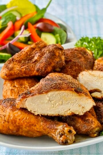 Copycat KFC Roast Chicken pieces on a white platter for featured square image.
