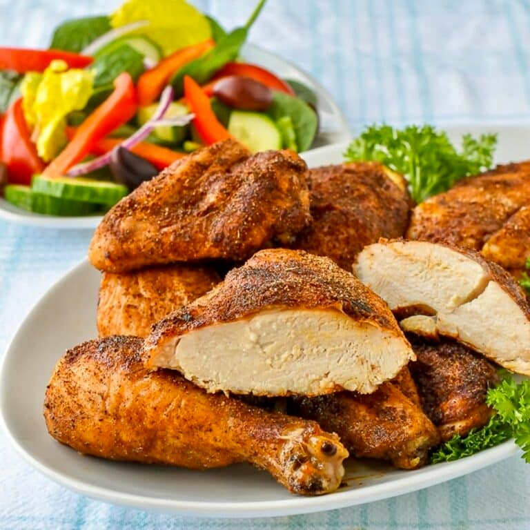 Copycat KFC Roast Chicken pieces on a white platter for featured square image.