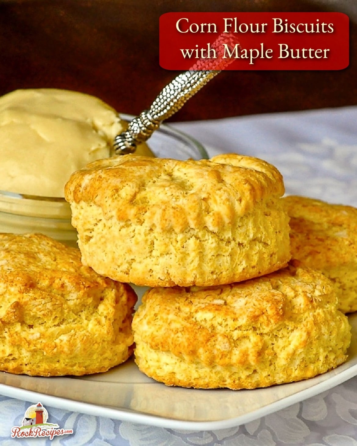 Corn Flour Biscuits with Maple Butter photo of biscuits stacked on a white plate with title text added for social media posts.