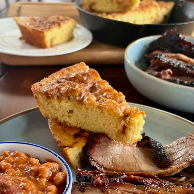 Photo of Sweet Brown Sugar Skillet Cornbread pictured with a smoked brisket dinner for Google featured image.