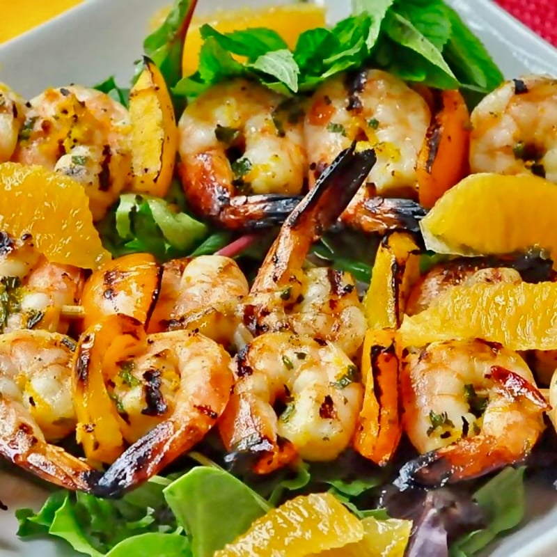 Orange Mint Grilled Shrimp on a sed of salad.