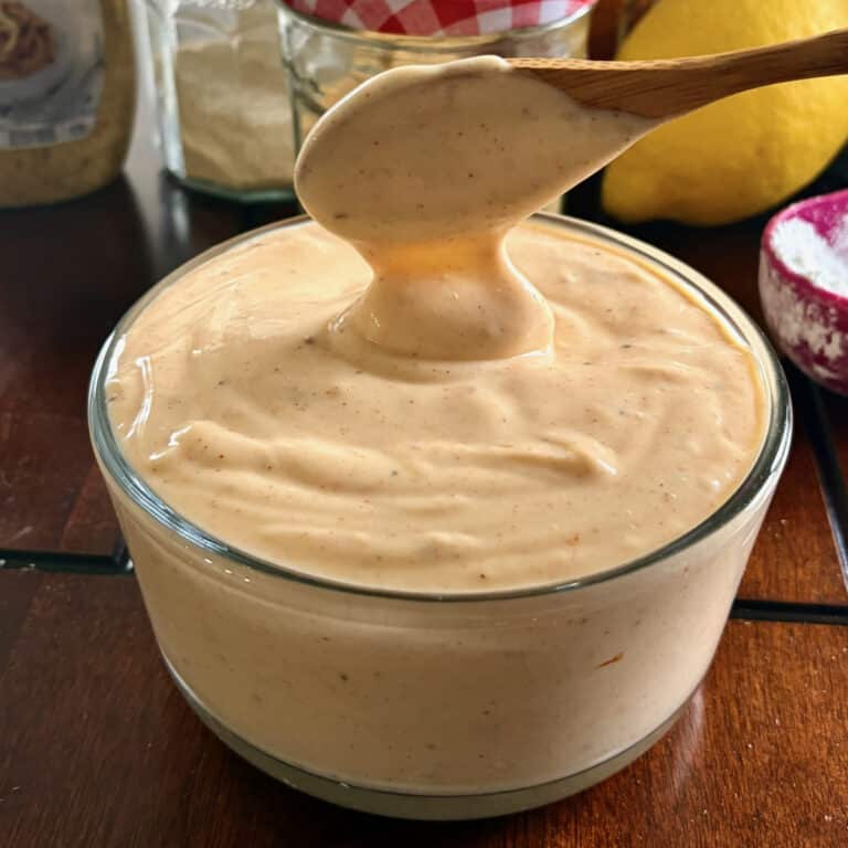 Better than Miracle Whip with a wooden spoon shown to serve the dressing.