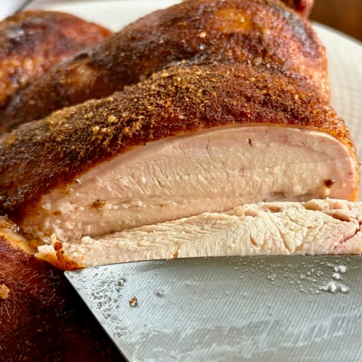 Smoky Summer Barbecue Chicken Spice photo of a smoked chicken being carved to show juicy breast meat.