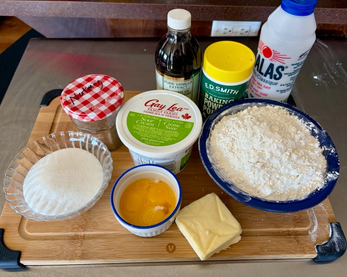 Photo of ingredients for sour cream donuts on a stainless steel background