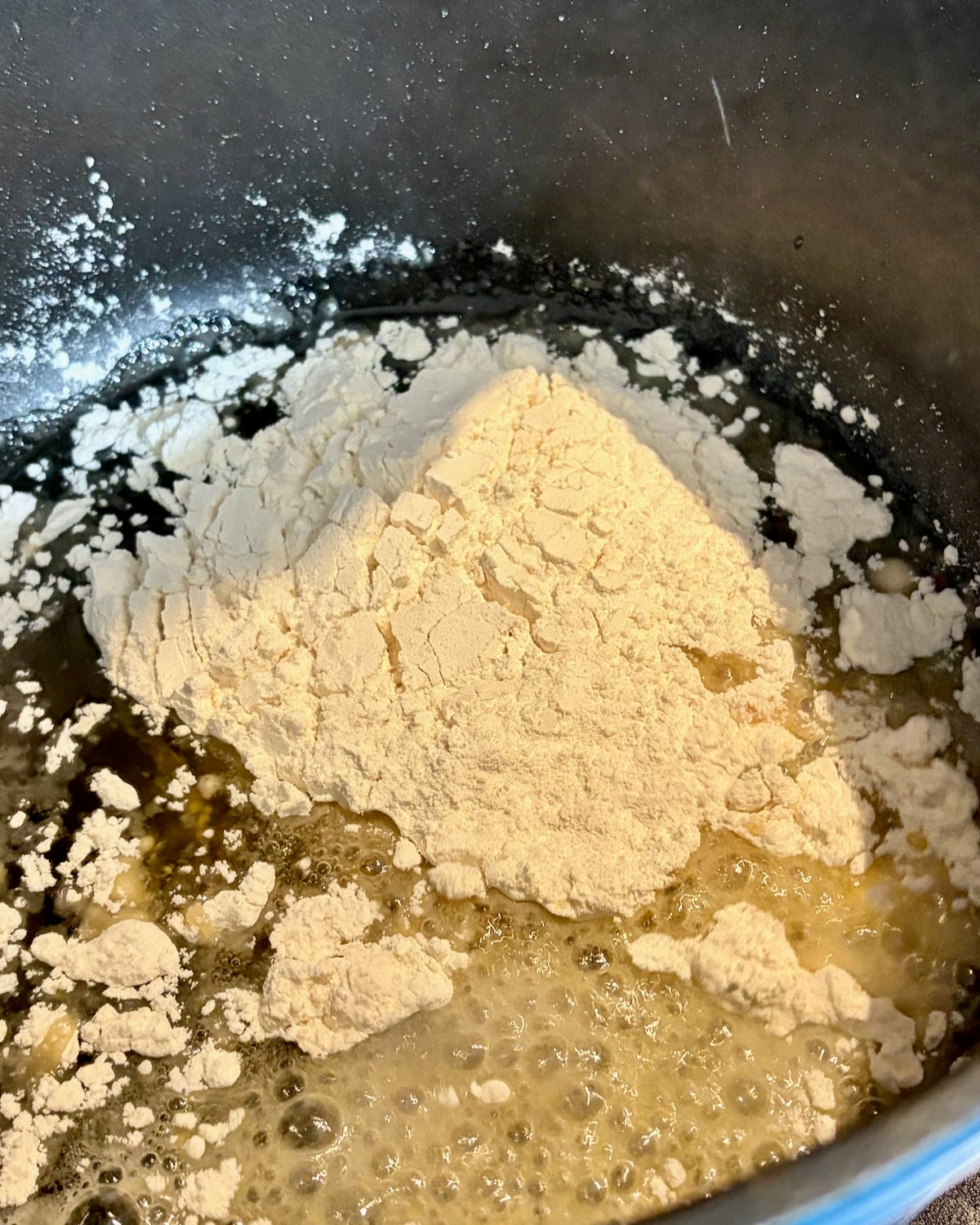 adding flour to the chicken fat