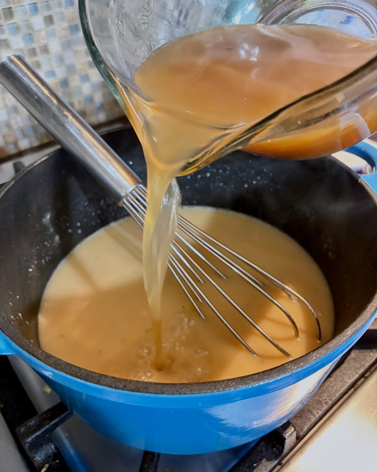 Adding stock in 3 stages to the roux