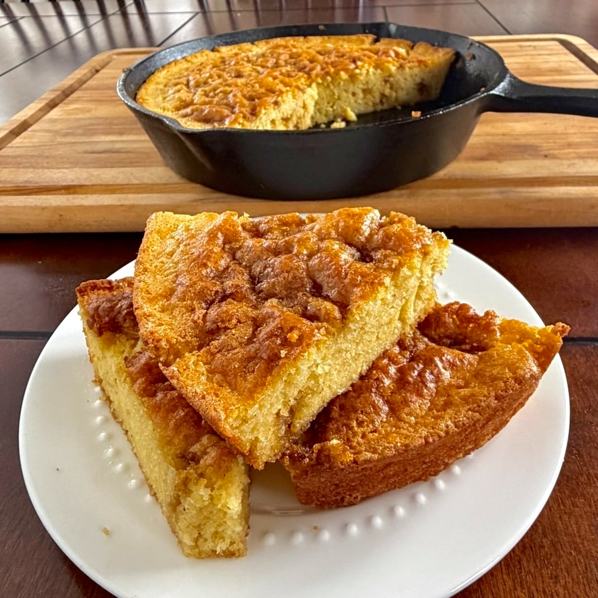 Sweet Brown Sugar Skillet Cornbread cut into wedges
