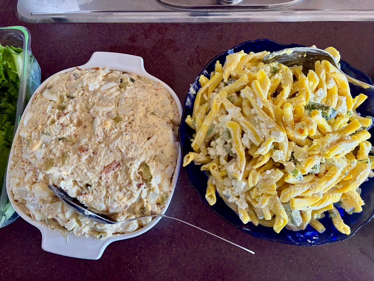 Overhead photo of potato salad and pasta salad.