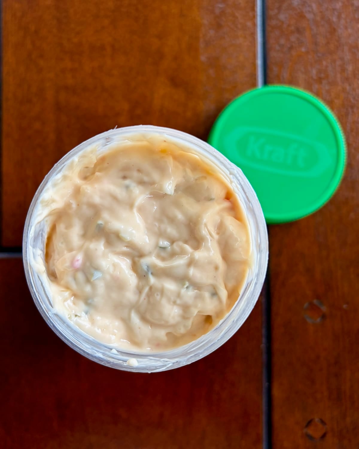 Photo of a jar of Kraft sandwich spread shot from above showing an open jar