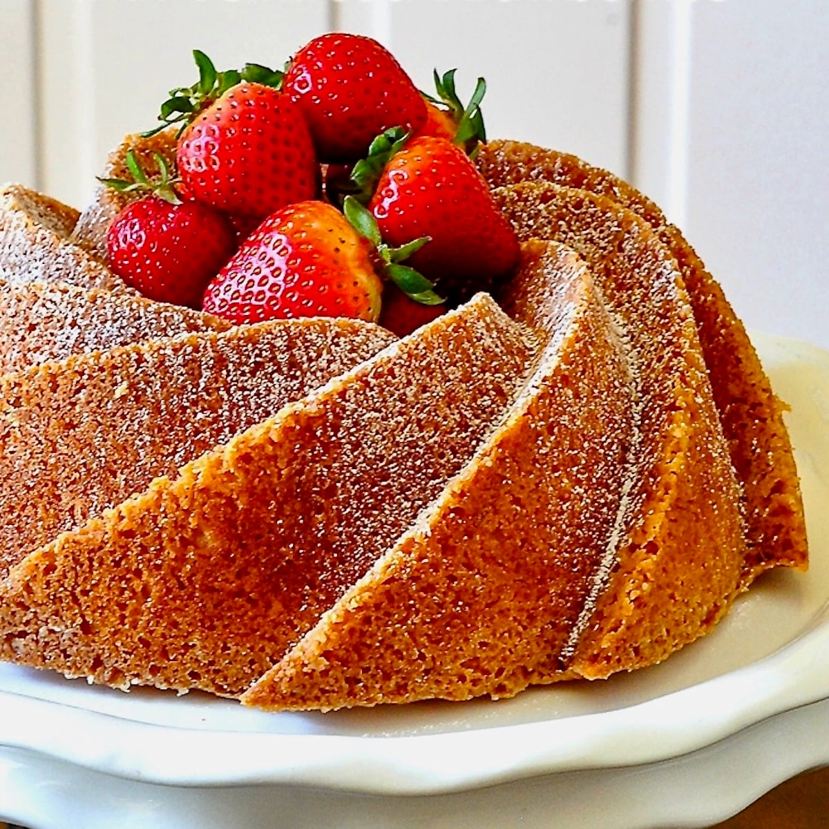 Orange Bundt Cake with Cointreau Marinated Strawberries