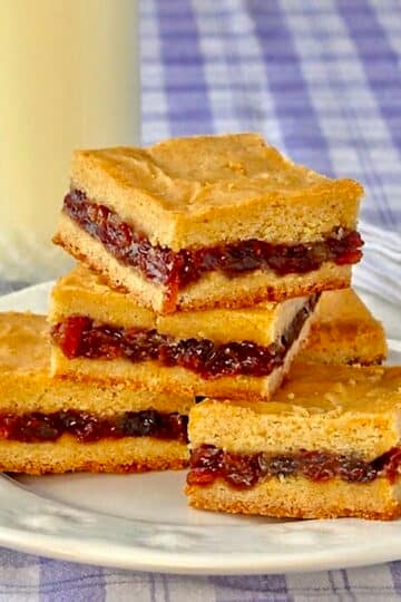 photo of Raisin Filled Cookies stacked on a white plate