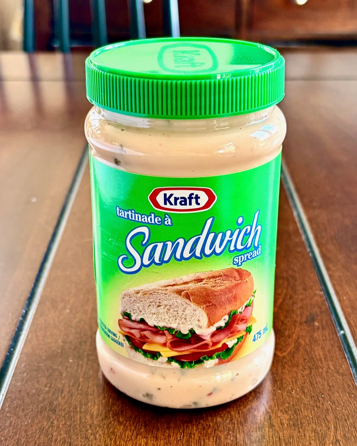 Photo of a bottle of Kraft Brand sandwich spread on a wooden table top