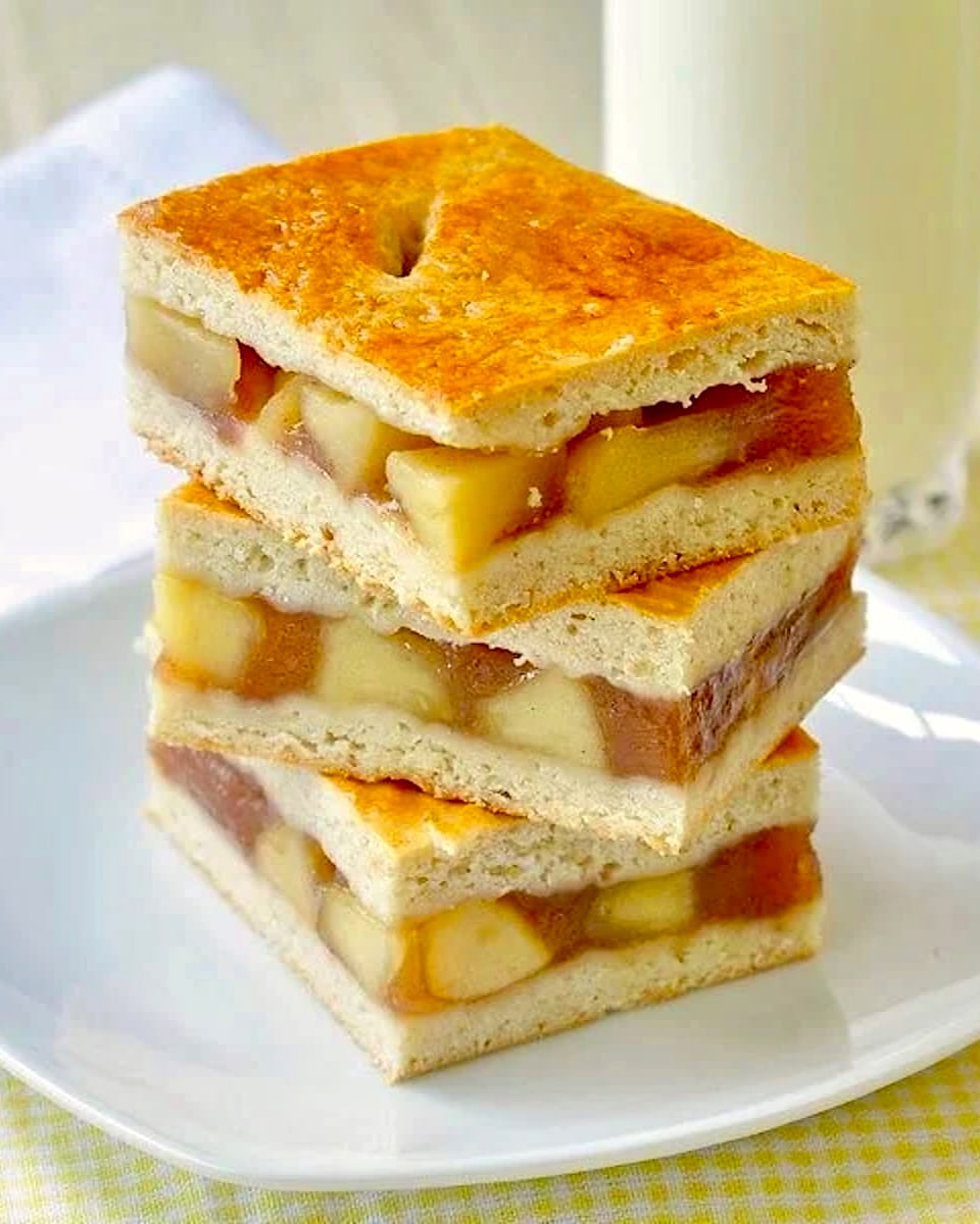 Photo of stacked apple cobbler bars.