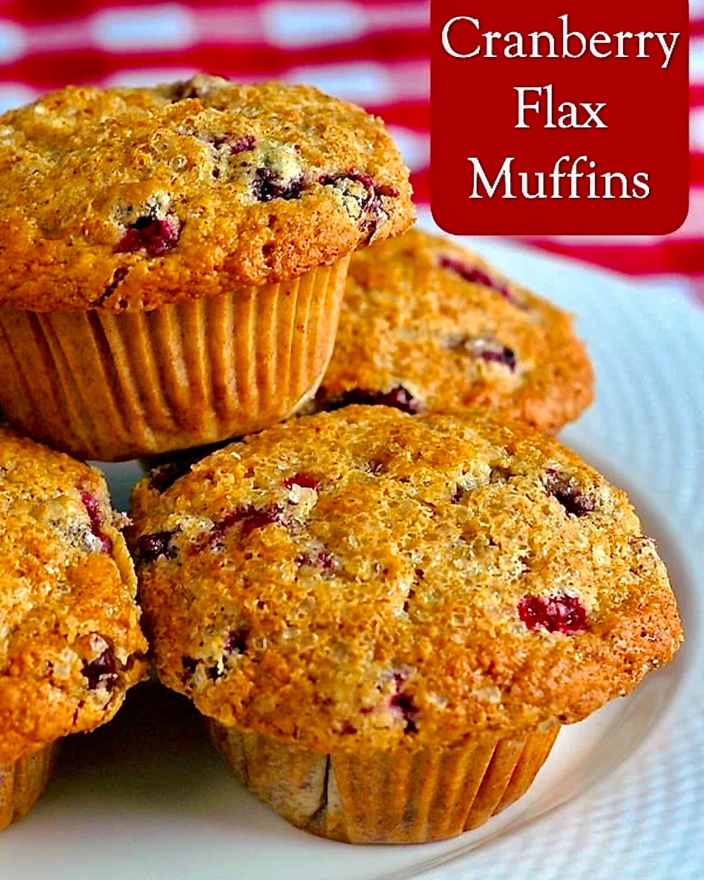 Cranberry Flax Muffins photo of stacked muffins with title text added for social media posts.