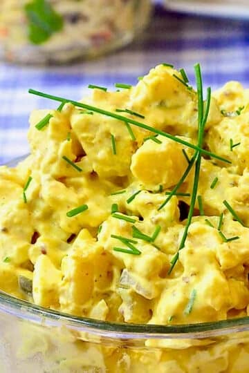 Deviled Egg Potato Salad close up photo of salad in a clear glass bowl