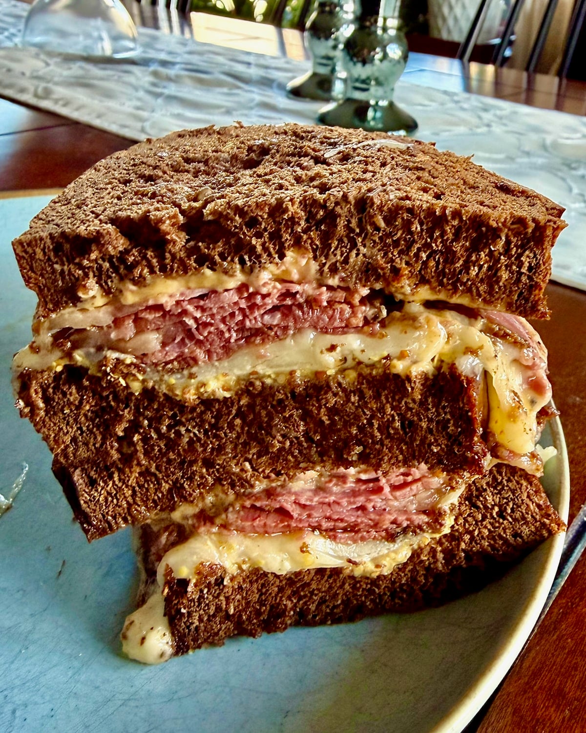Montreeal Smoked Meat, provolone cheese and mustard sandwich on Pumpernickel Bread.