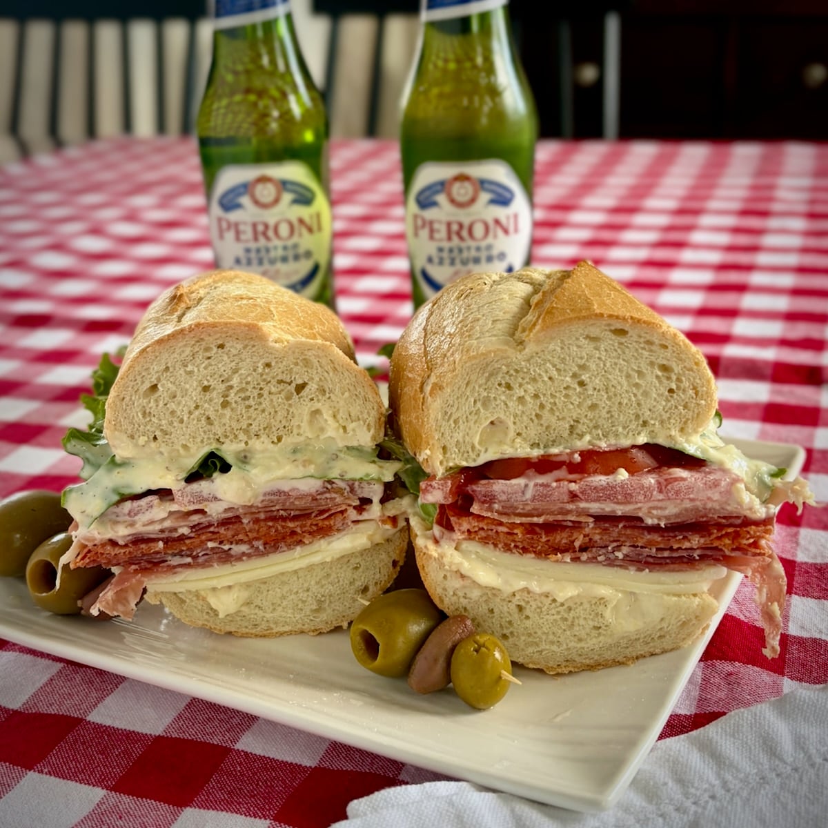 Photo of Italian sub cut in half to show filling including Creamy Lemon Parmesan Salad Dressing