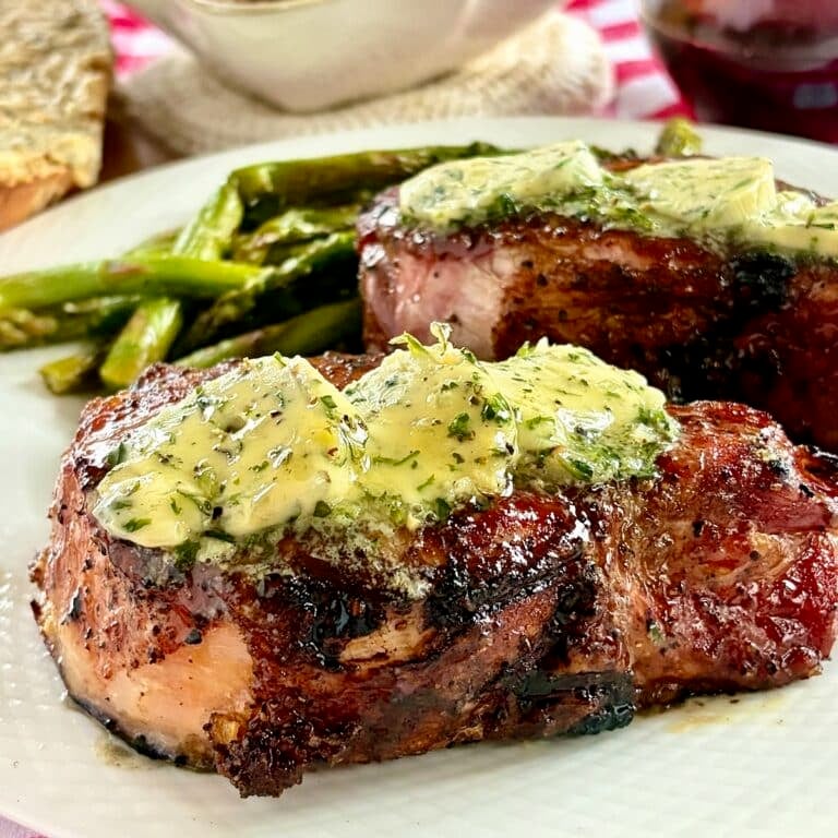 Garlic Herb Butter pictured melting over smoked Nagano Pork Chops.