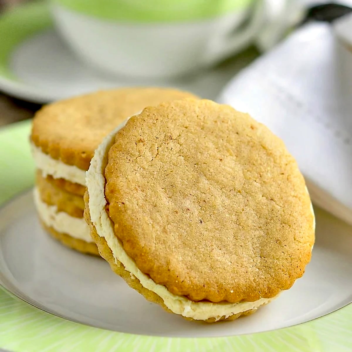 Maple Walnut Cookies featured post image of cookies on a green and white plate.