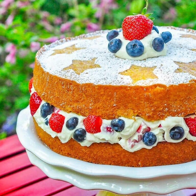 Red White and Blue Mascarpone Cream Cake close up photo of uncut cake
