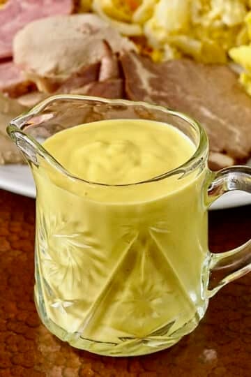 Sweet Mustard Sauce shown in small crystal glass jug
