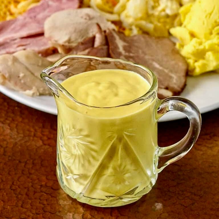 Sweet Mustard Sauce shown in small crystal glass jug
