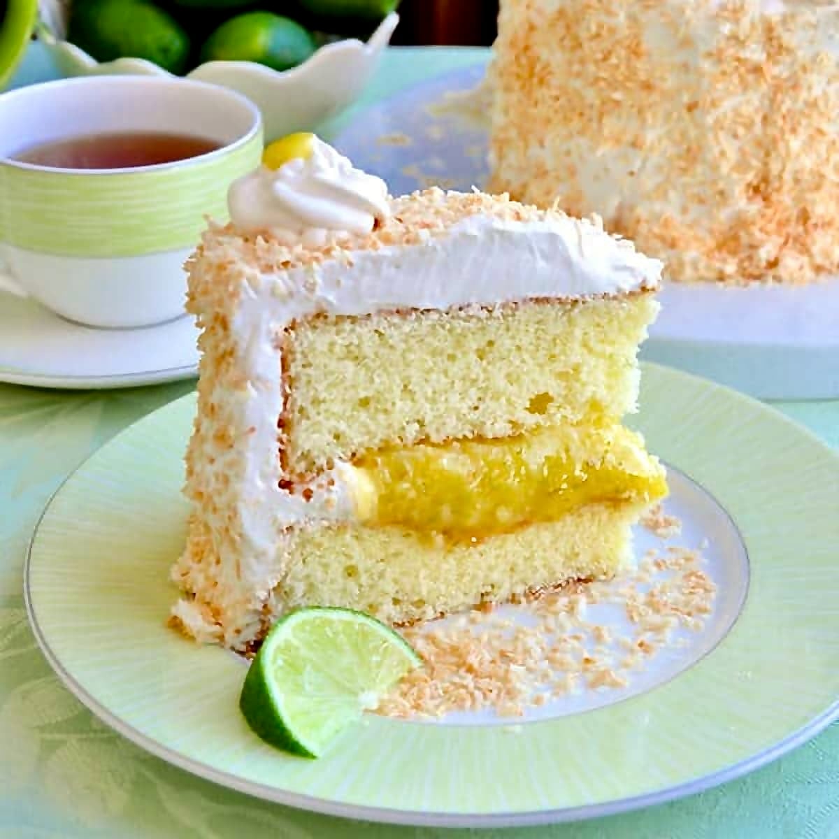 Coconut Lime Marshmallow Cake photo od=f one slice on a green tea service.