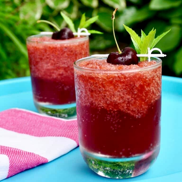 Cherry Vodka Slush photo of 2 cocktails in a teal coloured serving tray for Google featured image,