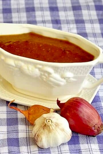 Vegetarian Onion Gravy in a white gravy boat.