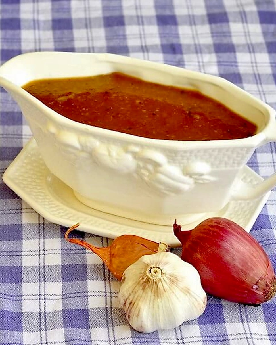 Vegetarian Onion Gravy in a white gravy boat.
