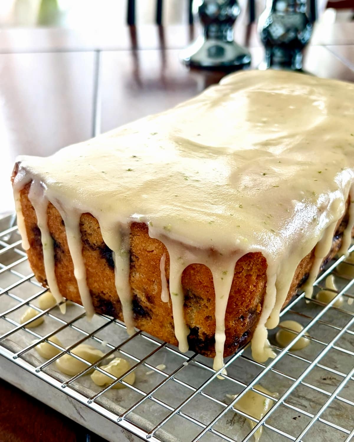 Photo of cake being glazed in a wire rack