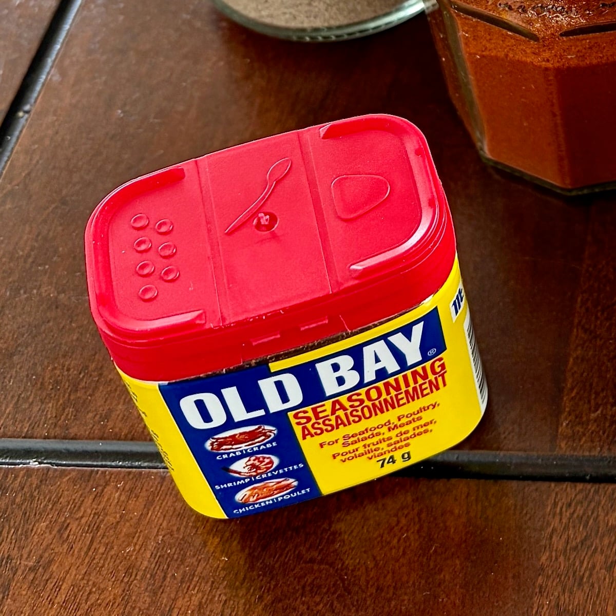 A photo a small canister of Old Bay brand seasoning.
