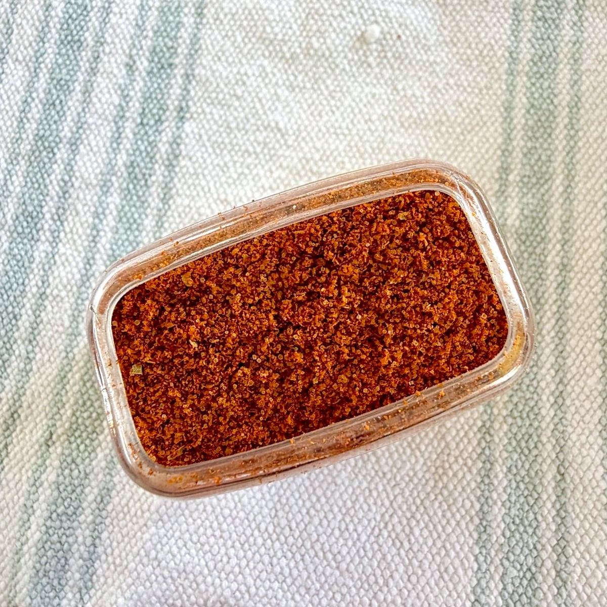 Overhead photo of a container of actual Old Bay Seasoning.