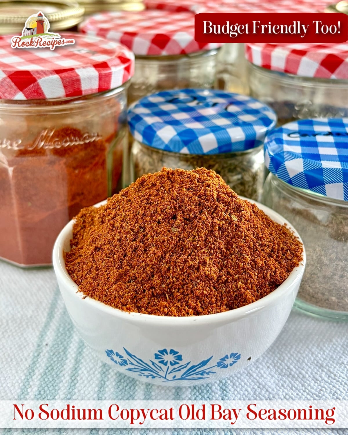 Photo of Copycat Old Bay Seasoning in a small white bowl with title text added for Pinterest and social media posts.