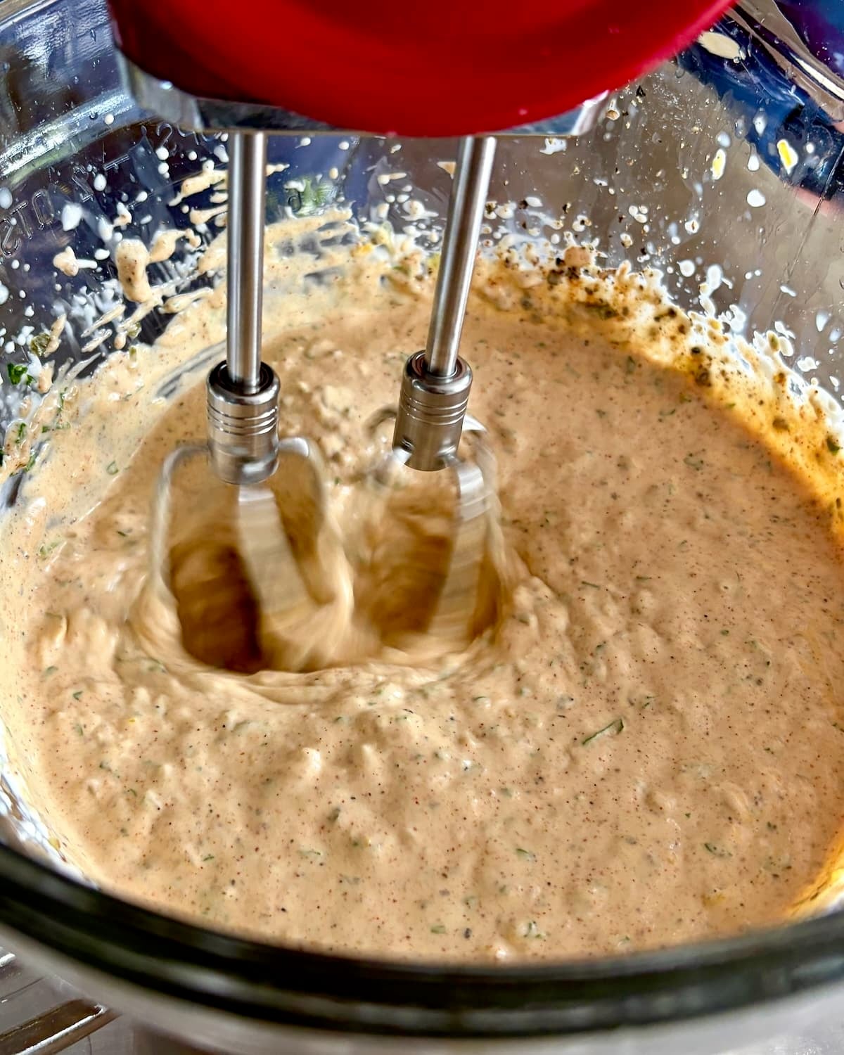 Photo of the final blending of the sace with a hand mixer.