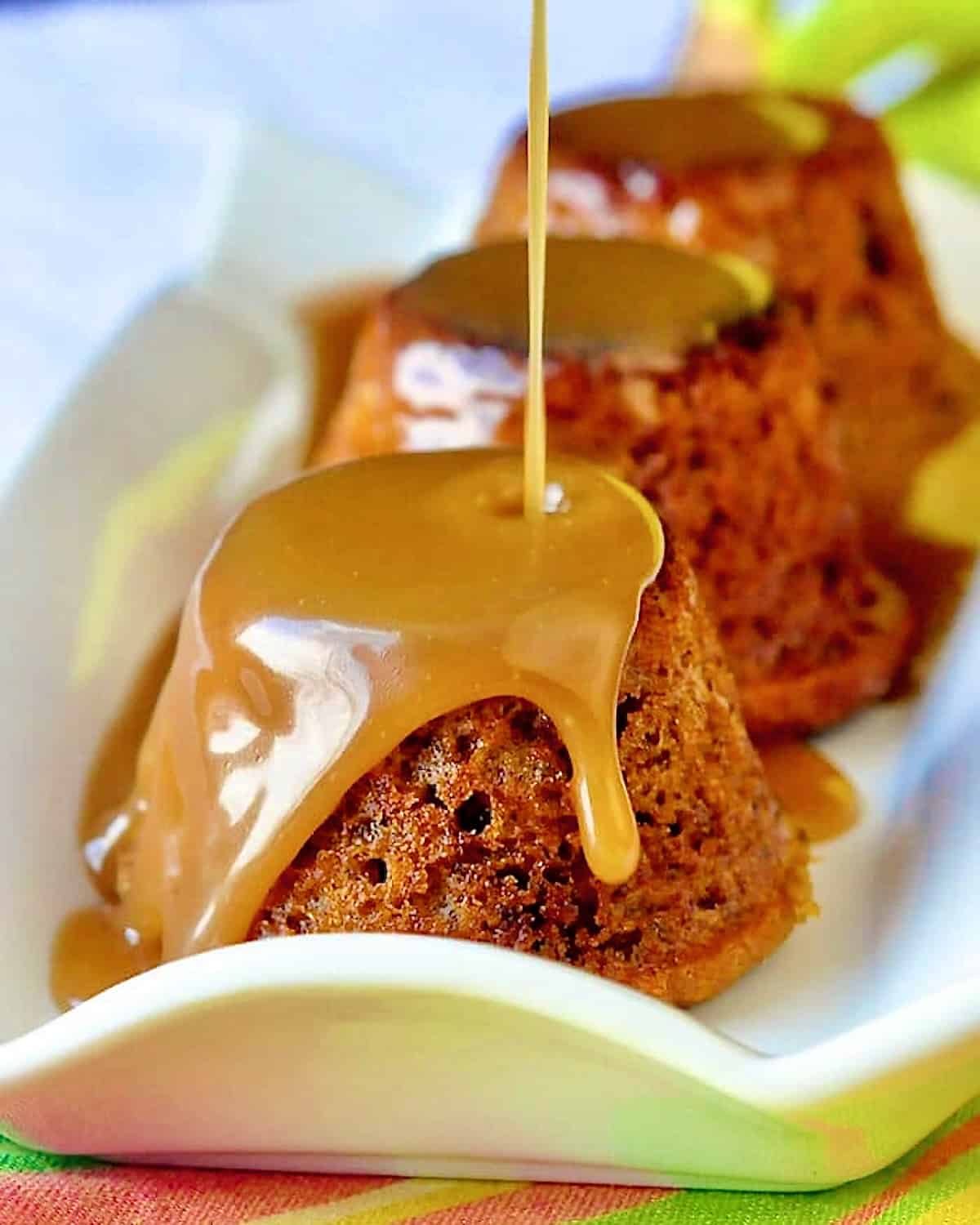 Sticky Toffee Banana Pudding photo with toffee sauce being poured on top.