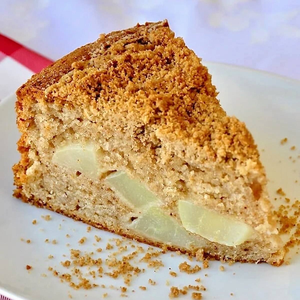 Streusel Spice Pear Cake photo of one slice on a white plate.