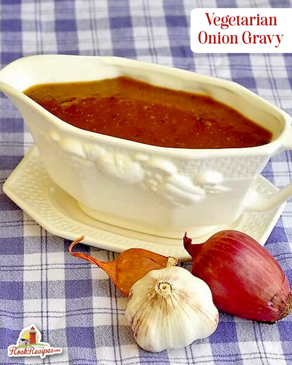 Vegetarian Onion Gravy in a white gravy boat with title text added for Pinterest and socil media posts.