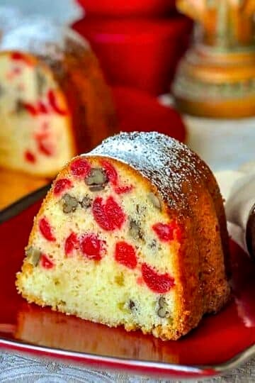Cherry Pecan Cake photo of a single slice in a red plate.