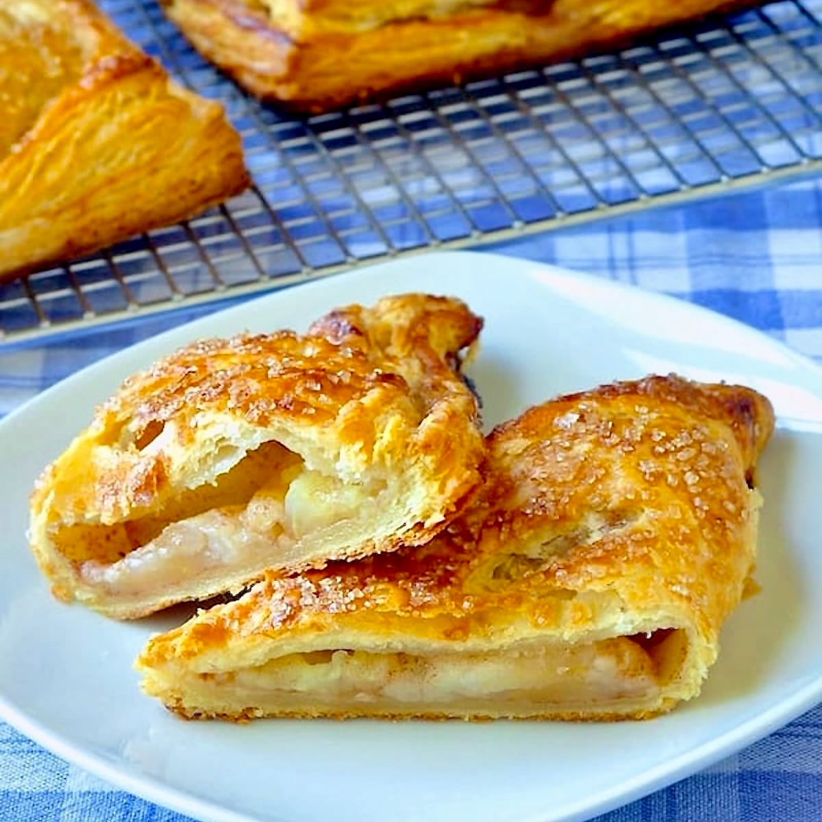 The Best Apple Turnovers close up photo of one turnover showing apple filling.