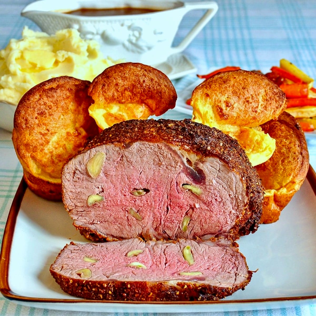 Garlic prime rib sliced open to reveal medium rare interior