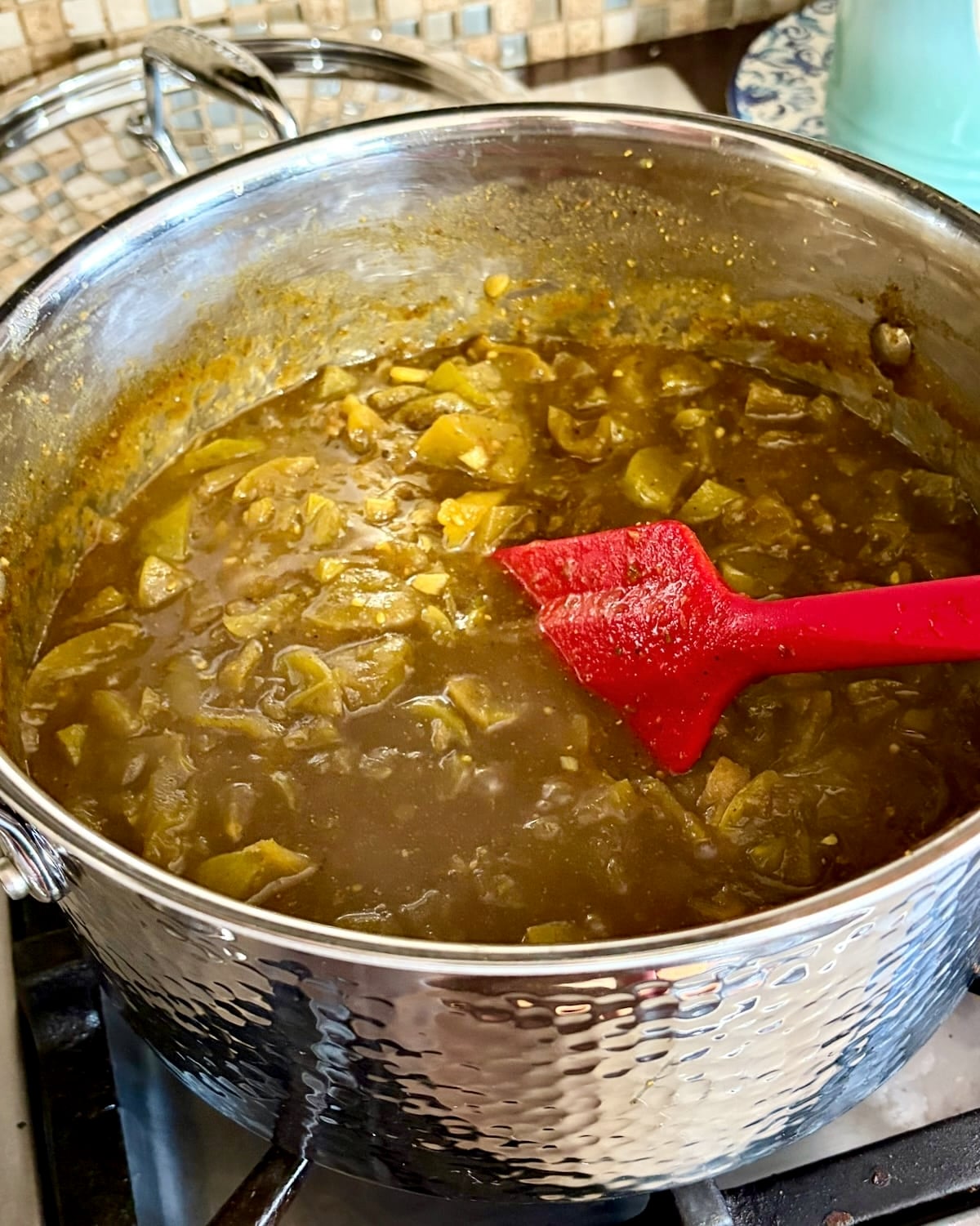 photo of Green Tomato Chow Chow simmering in a pot.