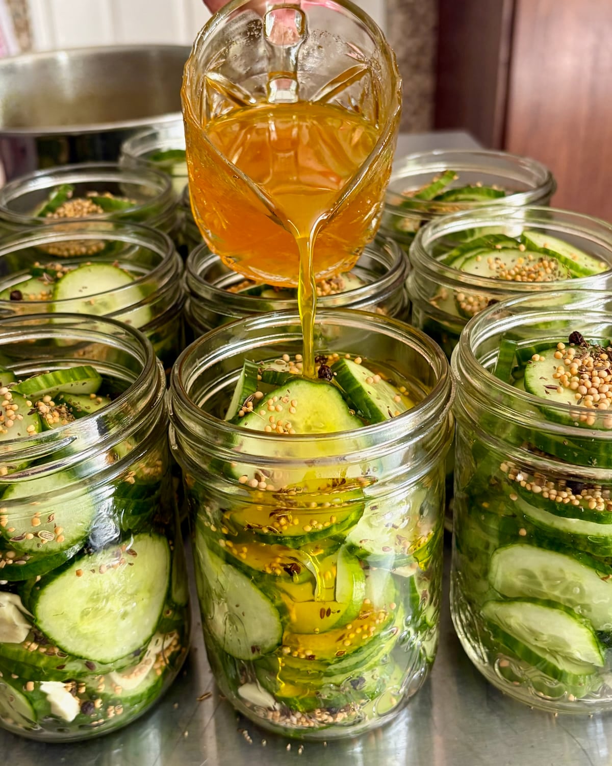 Photo of Adding the pickle brine to Sweet Yum Yum Pickles..