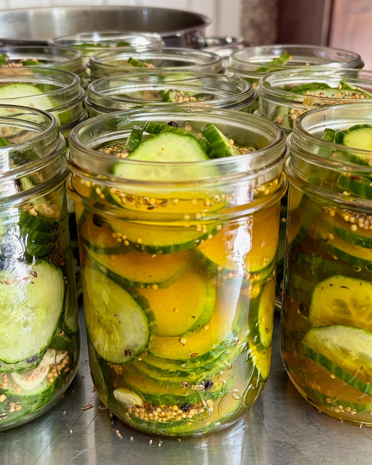 close up photo of pickles ready for lids.
